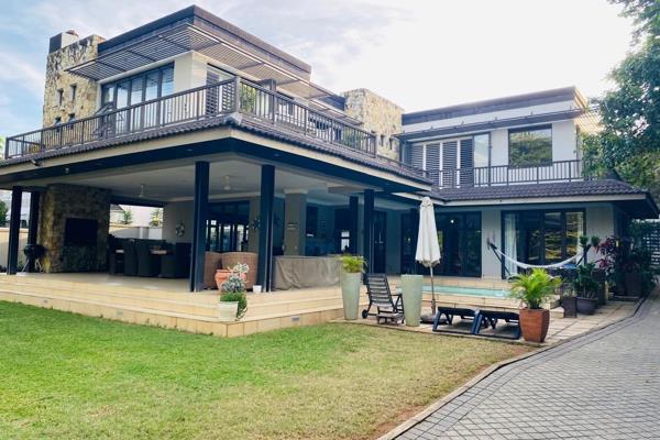 This custom built grand  double storey family  home  is situated in the most perfect central Umhlanga location.
Above the road, on ...