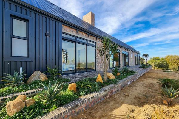 This is your family&#39;s opportunity to live by embracing architecture, design and nature in equal measure. With large framed glass ...