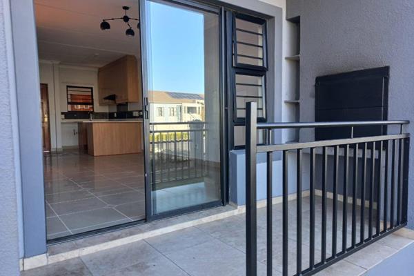 This modern ground floor apartment has an open plan kitchen and lounge leading to a private balcony with built in braai, 2 bedrooms and ...