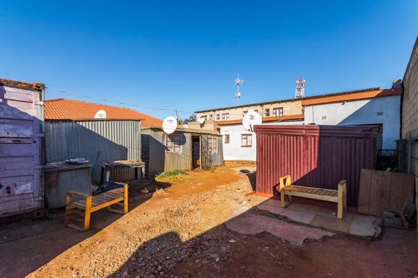 ideal opportunity for investment or development! This property features a spacious plot ...