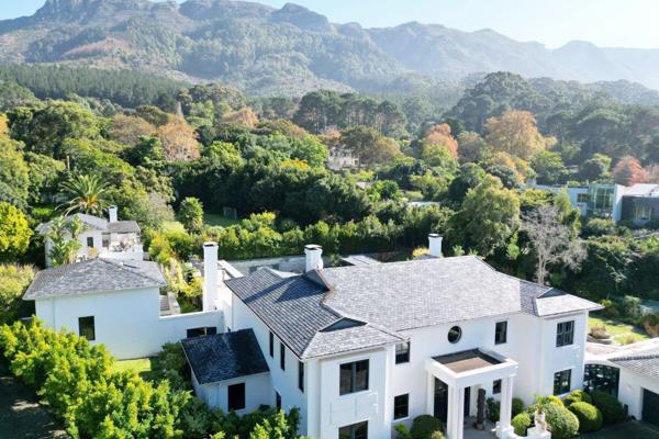 *** EXCLUSIVE LISTING ***

Located on a gorgeous winding road flanked by towering forests, the entrance to this property at the very top of Constantia Upper, tastefully plays down the grand scale of this private residence. Intelligently constructed at the end of a long ...