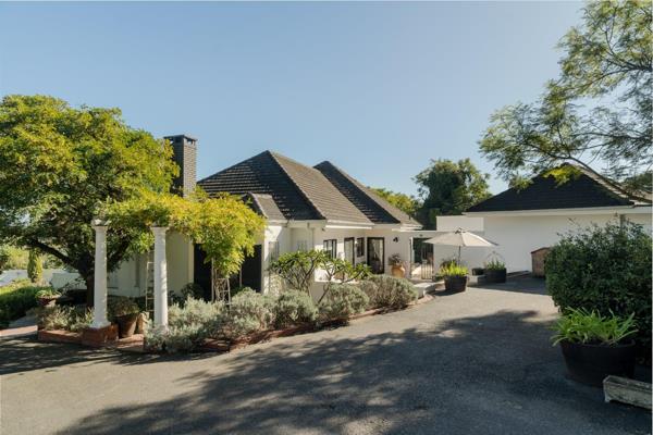 Upon approaching the gates of this charming, classic-style home, one is compelled to ...