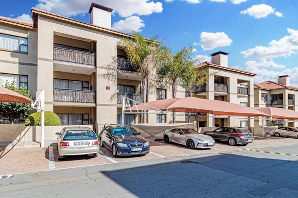 This inviting first-floor apartment in the secure 21 Sunset complex offers modern living ...