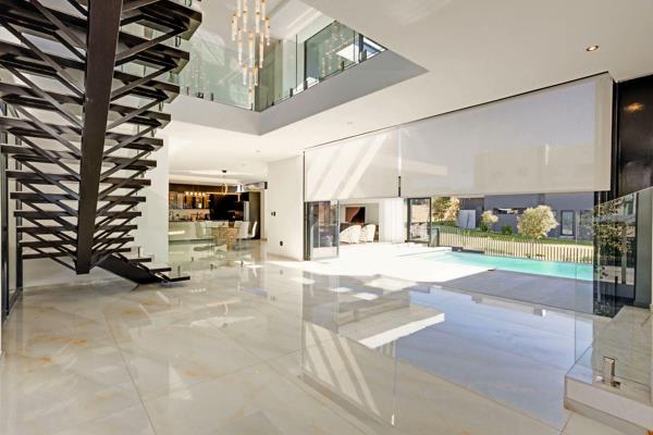 Step into exceptional luxury living in this architect-designed, contemporary family home, perfectly positioned on a corner stand ...