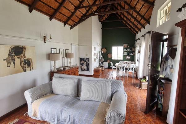 This charming 3 bedroom, 2 bathroom home offers a blend of comfort and character with its farm style thatch roof design. 

The main ...