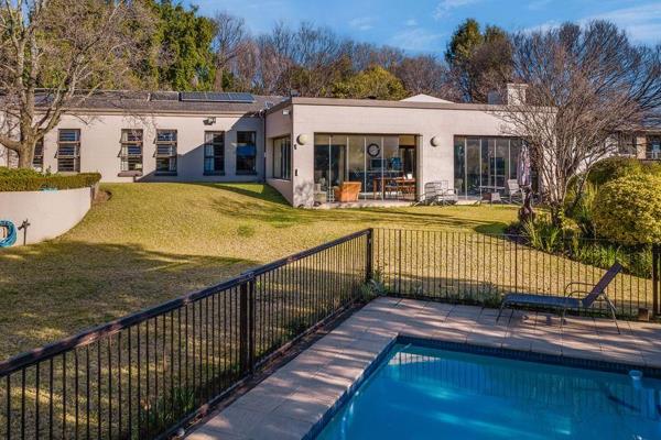 Nestled on a boomed, access-controlled cul-de-sac, this enchanting family home sits proudly atop an elevated driveway, basking in ...