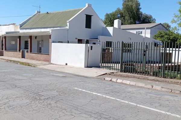 This versatile property is sub-divided into 4 units and currently leased for long-term ...