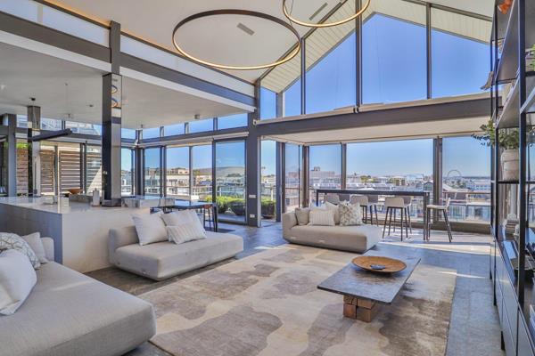 Arrive by private lift into this 341m² full-floor penthouse at the V&amp;A Waterfront Marina, a rare home where prestige ...