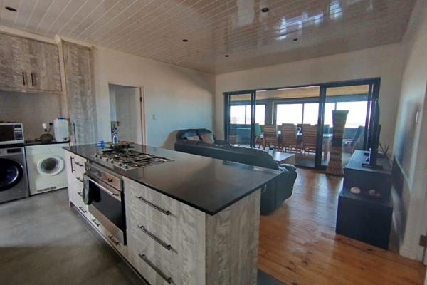 Modern 2-Bedroom Home With Indoor Braai &amp; Stunning Views

This lovely home offers two spacious bedrooms, each with sliding doors ...