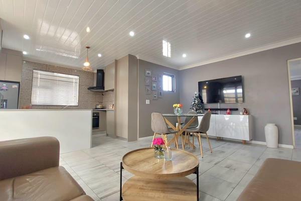 Ultra-modern 59 sqm flatlet featuring a spacious open-plan living area that seamlessly merges lounge, dining, and kitchen for airy ...