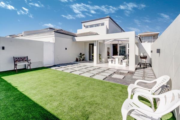 Experience the ultimate in modern luxury living in this stunning duplex with a separate entrance and entertainment area, perfectly ...