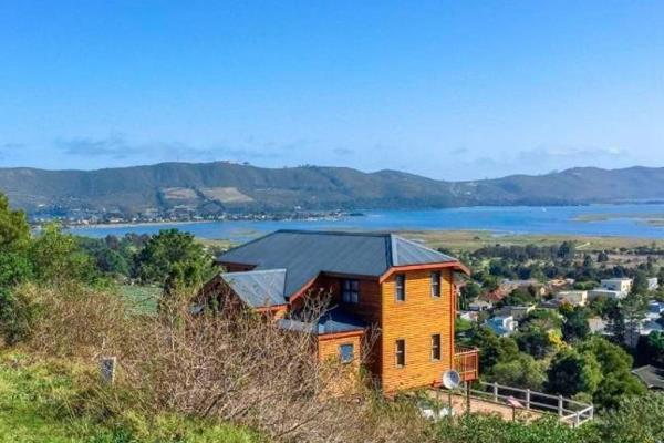 Experience elevated living in Fisher Haven with this inviting three bedroom, two bathroom house perched on a hillside. The sunlit deck ...