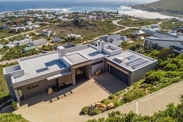 This striking contemporary residence is perched on a coastal hillside, seamlessly blending minimalist architecture with breathtaking, uninterrupted panoramas of the ocean. Designed ...