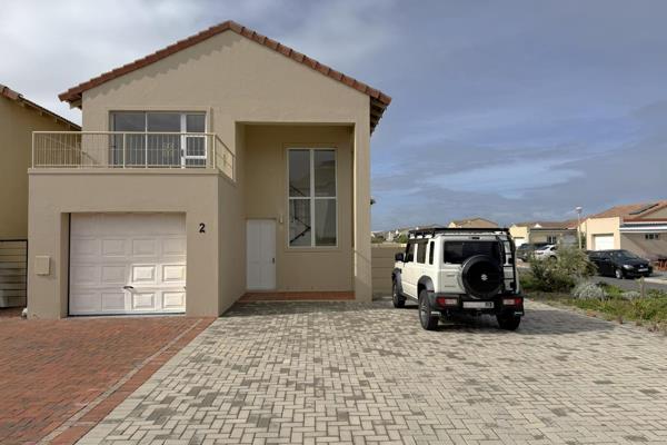 This spacious family home in the popular seaside security estate known as Capricorn ...