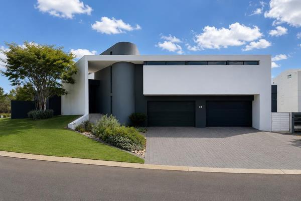 Situated in the prestigious Midstream Ridge Estate, this striking modern industrial home offers an unparalleled lifestyle of luxury ...