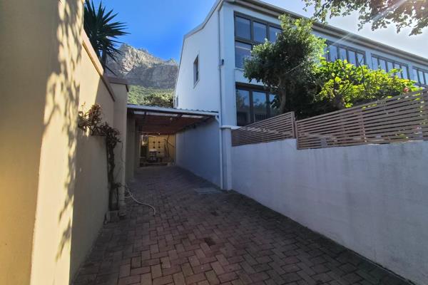 This neat and secure top floor apartment is conveniently located in central Muizenberg ...