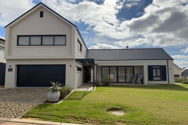 Positioned within the prestigious Renosterbos Estate, this exceptional residence ...