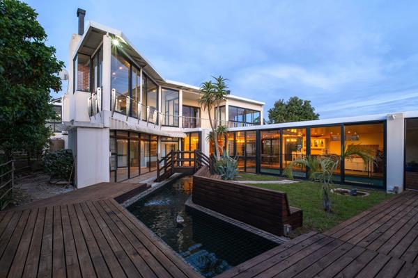A white stucco villa behind a gate, palms framing the drive, the kind of facade Plattekloof has built its reputation on. What it ...