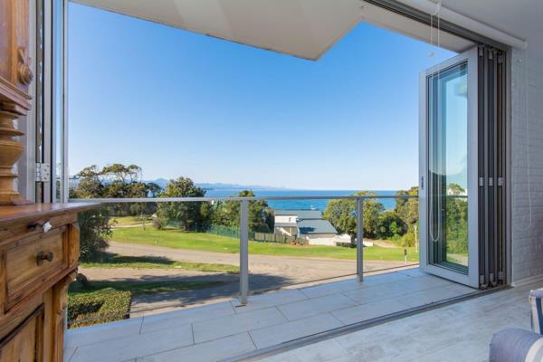 This gorgeous, north-east facing duplex apartment with captivating views ready for your holiday stay.

Entering the light and airy unit ...