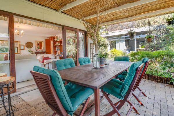 Nestled within a secure boomed-off section, this delightful home exudes warmth and character with its cottage-style farmhouse ...