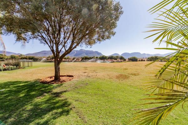 Welcome to this well-designed 5-bedroom home, perfectly positioned on the golf course. The open-plan living areas flow through stack ...