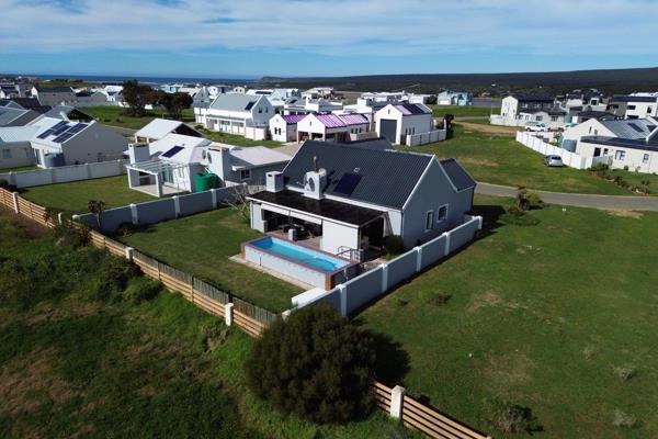 Enjoy secure, relaxed coastal living in this beautifully maintained 3-bedroom ...