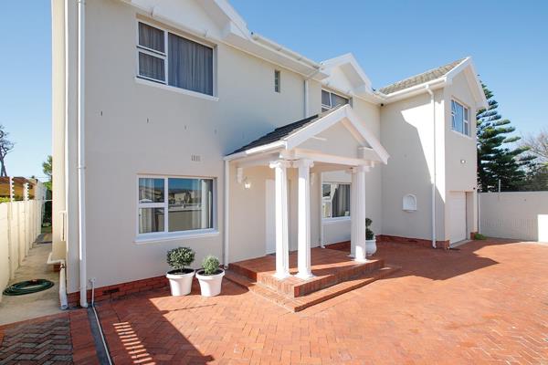 This modern double-storey family home offers four bedrooms (three with built-in ...