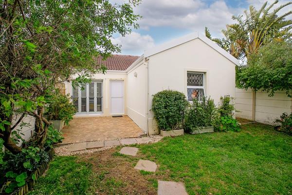 This beautiful property is neatly tucked into Normandy Village's treelined inner ...