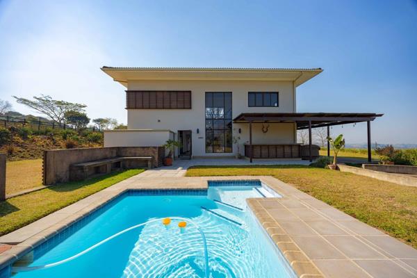 From the moment you arrive, this exceptional home creates a lasting impression. As you make your way up the expansive driveway ...