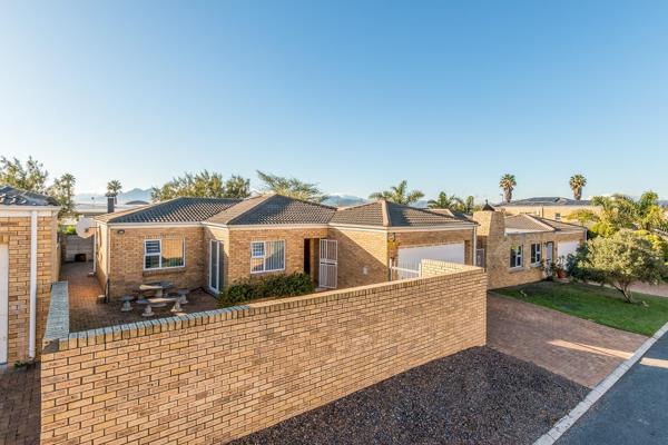 Welcome to this beautiful three-bedroom family home, perfectly positioned within a sought-after gated community. Offering privacy ...