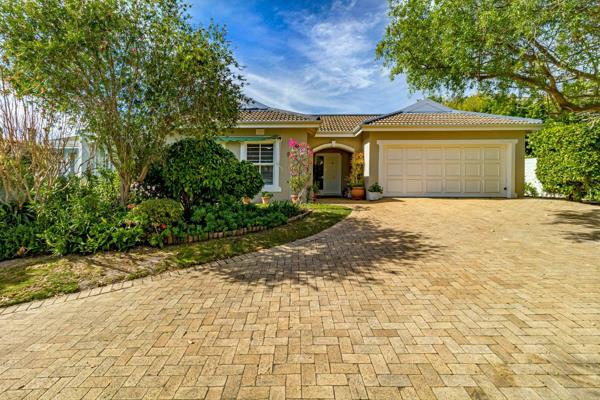 Nestled within an established, leafy garden, this well-maintained home offers a ...