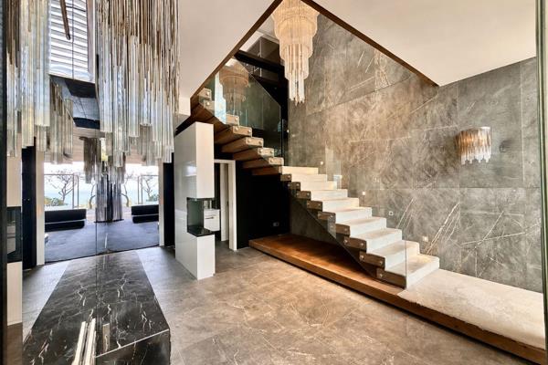 A remarkable private residence suspended above the Camps Bay coastline, with uninterrupted views across the beach, Atlantic Ocean, Lion’s Head and the Twelve Apostles.

This exceptional duplex combines generous proportions with a ...