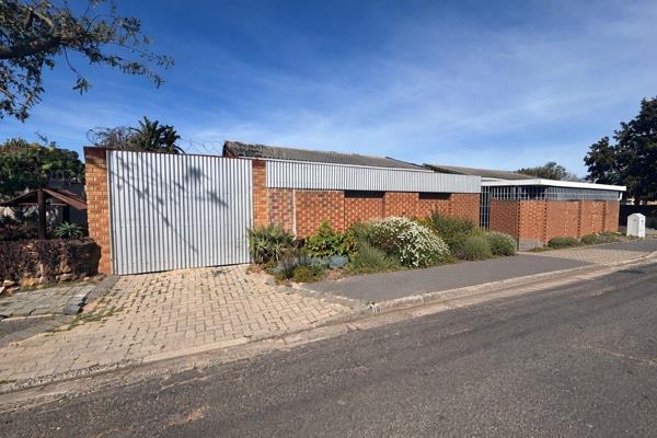 This well-loved brick-and-tile home offers comfortable, low-maintenance living with genuine character. Enclosed by a secure brick wall ...
