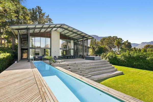 Perched within a beautiful forest setting in the sought-after Klein Leeukoppie Estate, this bold and aesthetically striking home is ...