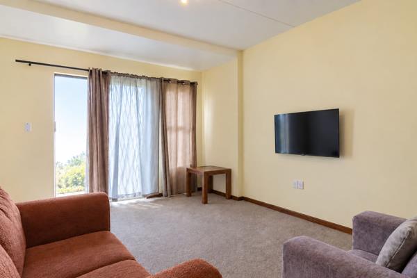 This inviting two-bedroom ground-floor apartment offers comfortable, convenient living ...