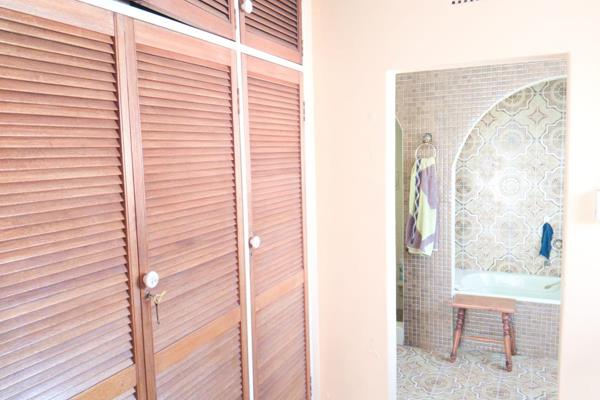 This spacious property features four bedrooms and two bathrooms, including a main bedroom located on the second floor with a full ...