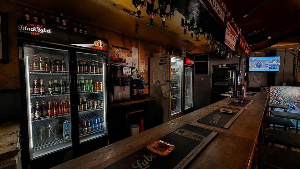 Listing number: P24-117680027, Image number: 3, The bar counter and its fridges, spirit optics overhead and a television at the far end