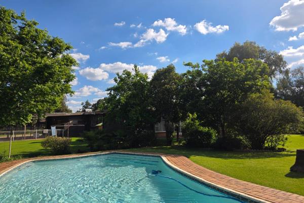 Set on a generous 1,984m² erf with approximately 311m² under roof, this well-appointed family home offers comfortable living ...