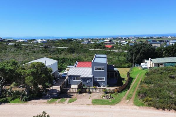 EXCLUSIVE SOLE MANDATE - This sunfilled home offers the following:-
Downstairs:
A ...