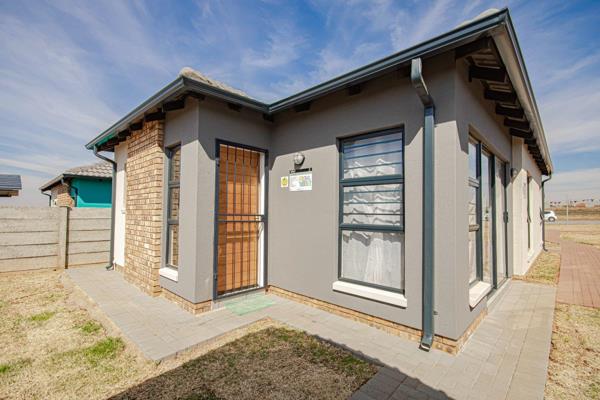 Discover a welcoming family home in Toekomsrus where light flows through open plan ...
