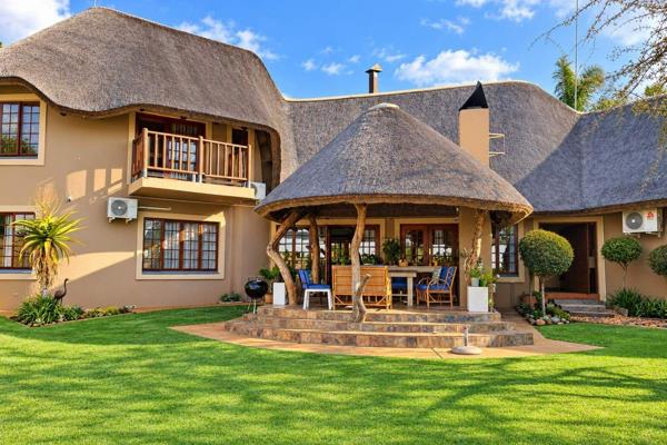 Dual Mandate!!
Fall in love with the beauty, space and character of this stunning thatched-roof home!
Step into a world of warmth and ...
