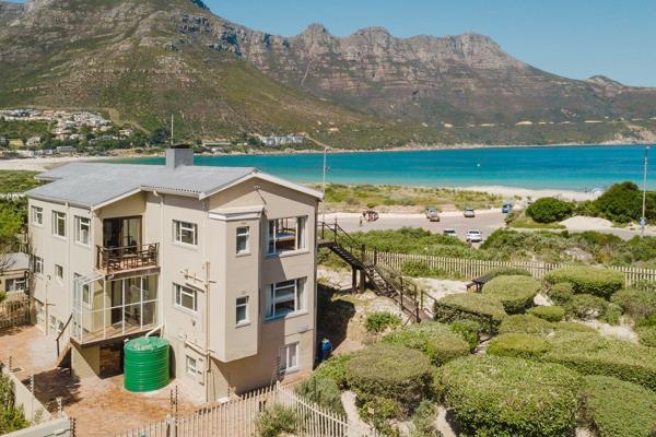 An exceptional opportunity to acquire a unique coastal property directly overlooking Hout Bay Beach, with established guest ...